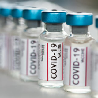 Covid-19 Coronavirus Vaccine vials in a row macro close up